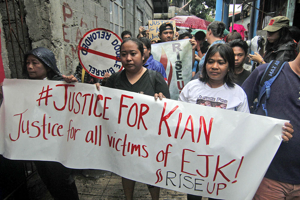 Families and relatives of people killed in police anti-drug operations protest the killing of Kian Loyd Delos Santos in Caloocan City, August 21, 2017. VINCENT GO